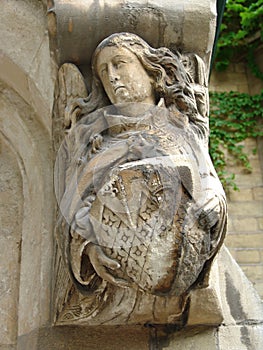 Angel with shield on door archway