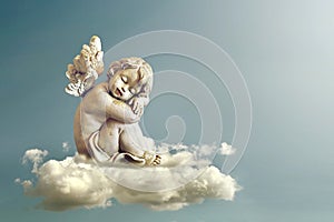 Angel sleeping on the cloud