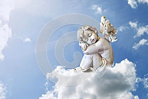 Angel sleeping on the cloud