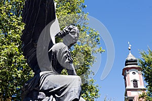 Angel statue with the church tower on Mainau island/Germany