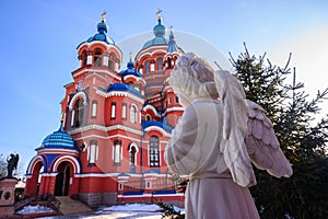 The angel statue infront of Kazan Church an iconic Orthodox church in the city of Irkutsk, Russia.