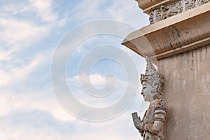 The angel stucco sculpture on the wall corner of the buddhist chapel temple