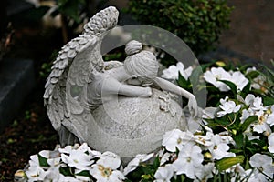 Angel weeping at gravestone