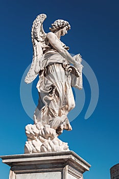 Angel with whips on the bridge of Saint Angel in Rome photo