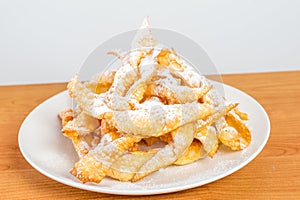 Angel wings with powdered sugar. Polish Faworki and chrusty are the plural forms of the words faworek and chrust respectively