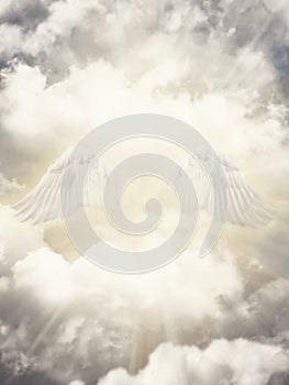 Angel wings in th heaven. Heavenly clouds and sun rays illustration