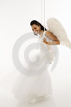 Angelic bride on swing.