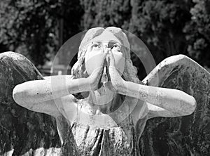 Angelic figure on cemetery photo