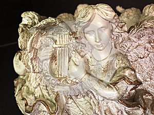 Angelic lyre player in sacred stringed performance