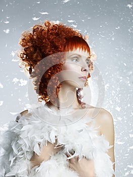 Angelic woman with red hair hairdo