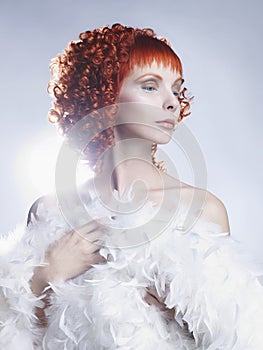 Angelic woman with red hair hairdo