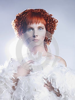 Angelic woman with red hair hairdo