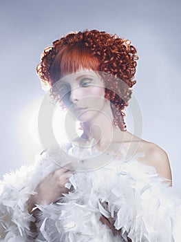 Angelic woman with red hair hairdo