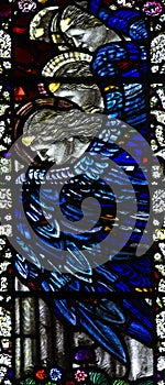 Angels with blue wings in stained glass