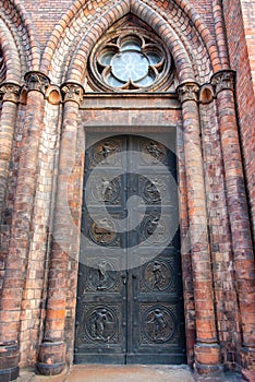 Angels carving on church doors in Berlin, Germany. Detail of the metallic panel on the temple doorway, entrance to the church.