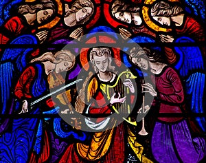 Angels making music in stained glass photo