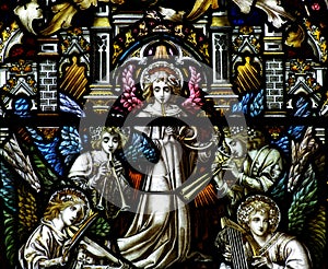 Angels making music in stained glass photo