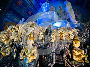 Angels Press The Hands Together at The Chest under Base of The White Buddha