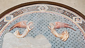 Angels on wall painting, fresco in Basilica San Domenico Siena, interior of Church, Tuscany, Italy