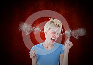 anger young woman with steam on ears. Black and red background photo