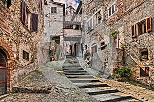 Anghiari, Arezzo, Tuscany, Italy: ancient narrow alley with staircase in the medieval village