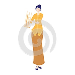 Angklung woman play traditional musical instrument from bamboo, female wearing traditional west java Indonesia costume photo