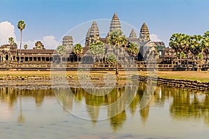 Angkor Wat across the lake, reflected in water