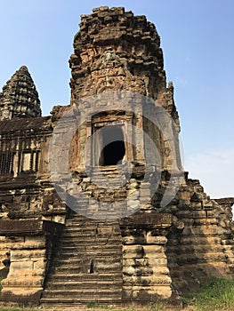 Angkor Wat in Siem Reap, Cambodia. Ancient Khmer stone temple ruins in jungle forest