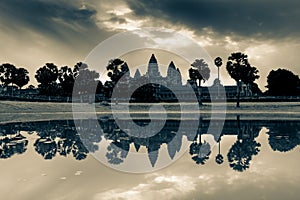 Angkor Wat Temple with reflection on water before sunset Siem Reap Cambodia in split tone. photo