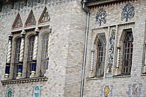 Angle of antique building wth windows. Architecture large building of antique roman style with pillar