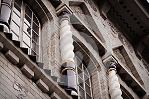 Angle of antique building wth windows. Architecture large building of antique roman style with pillar