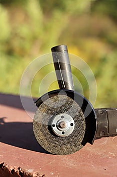 Angle grinder with battery. Power tool close-up