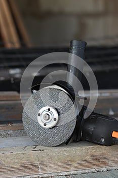 Angle grinder with battery. Power tool close-up