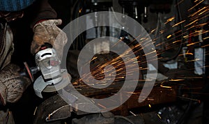 Angle grinder cutting steel with sparks