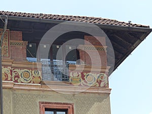 Angle of a house with some frescos in the historical center of Milan in Italy.