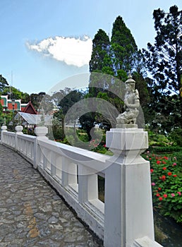 Angle sculpture on garden bridge at Phuping Rajanives Palace