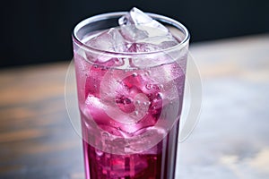 an angle shot of grape soda can with pull-tab