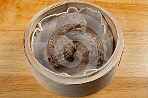 angle view fresh beef balls in bamboo steamer