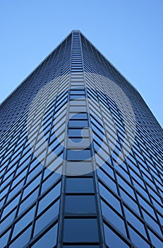 Angle view of a glass-windowed skyscraper photo