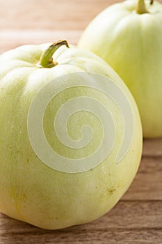 angle view muskmelons on wood background at vertical composition