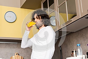 Angle view of thoughtful man drinking