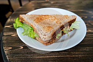 Angle view of triangle clubhouse sandwich on plate