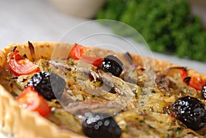 Angled onion and olive pie photo