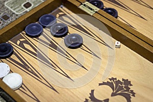 Angled shoot of dice of backgammon under dim light