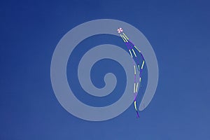 Angled view of a colorful kite flying waving photo