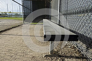 Angled view of the dugout on a baseball field, without any people around