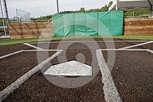 Angled view of a large, empty baseball field on a bright, sunny day