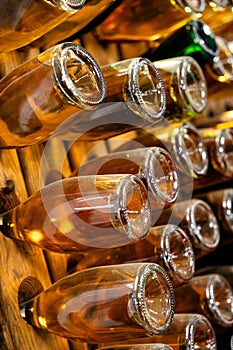Angled View of Sparkling Wine Bottles on Wooden Racks