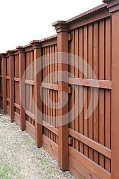 Angled view of a tall wood fence