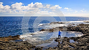 Angler on El Bufadero, rocky seashore on Gran Canaria photo